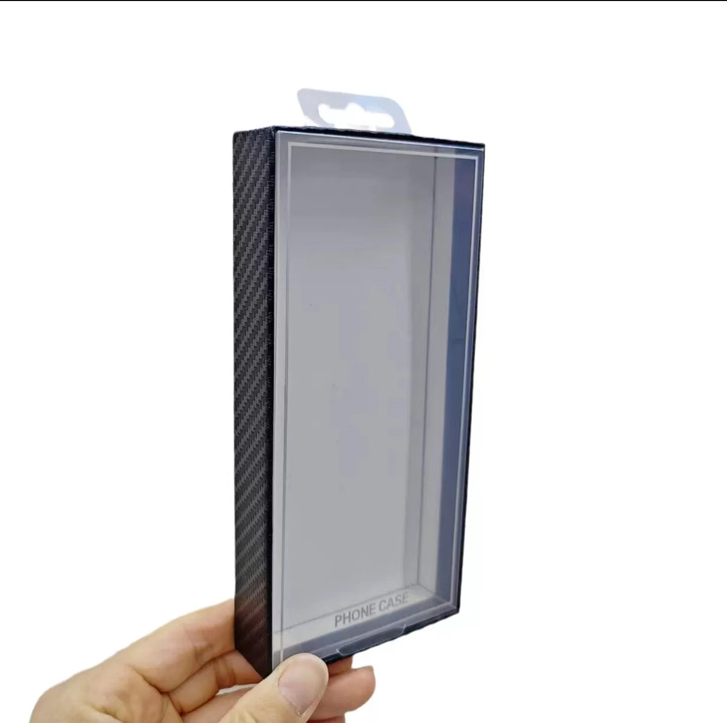 Carbon fiber textured phone case packaging boxes with blister tops are a hot seller on cross-border e-commerce platforms.