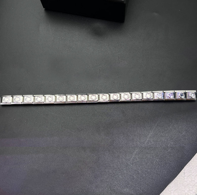 Italian Charms patterned modular bracelet with square elastic titanium steel strap.