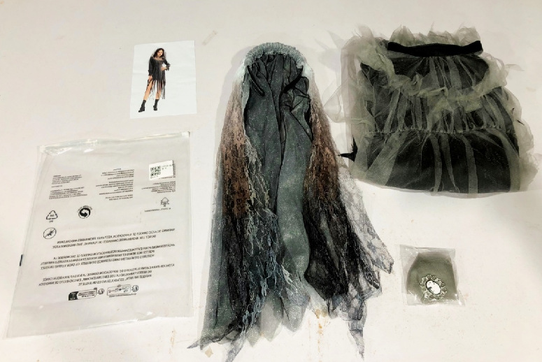 Halloween costume featuring a spooky, ghostly bride, a long, irregularly shaped tulle skirt, perfect for stage performances.