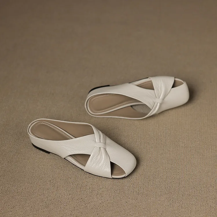 A pair of square-toe slippers, fashionable spring/summer style, made of sheepskin, half-length slippers, comfortable and soft, closed-toe women's shoes.